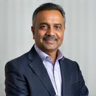 Professional headshot of Ajay Sharma, CEO of Ignite Apps